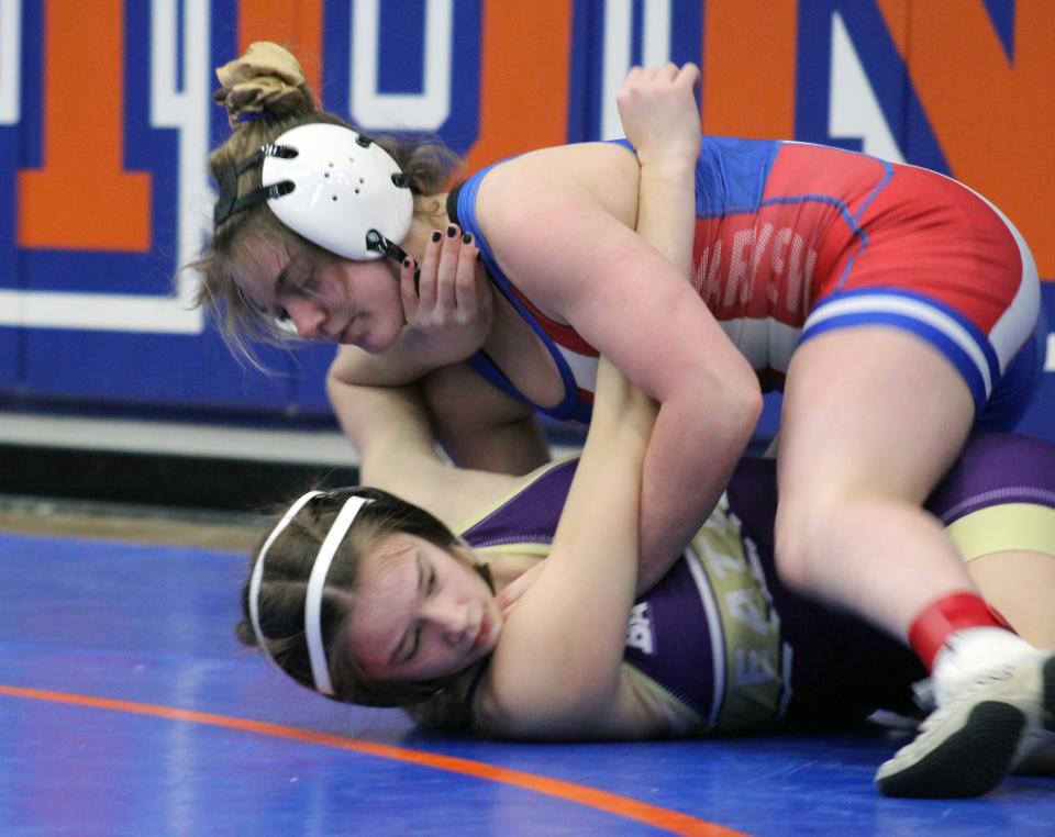 Marysville’s Cami Leng, top, competes in the Pioneer Classic on Jan. 13 at Olentangy Orange. Leng finished third at 115 pounds, helping the Monarchs finish second (168) behind Orange (207).