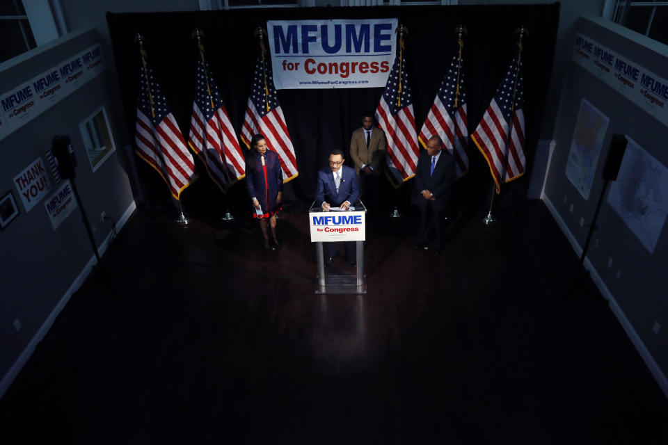 Democrat Kweisi Mfume, center, speaks to reporters during an election night news conference after he won the 7th Congressional District special election, Tuesday, April 28, 2020, in Baltimore. Mfume defeated Republican Kimberly Klacik to finish the term of the late Rep. Elijah Cummings, retaking a Maryland congressional seat Mfume held for five terms before leaving to lead the NAACP. All voters in the 7th Congressional District were strongly urged to vote by mail in an unprecedented election dramatically reshaped by the coronavirus pandemic. (AP Photo/Julio Cortez)