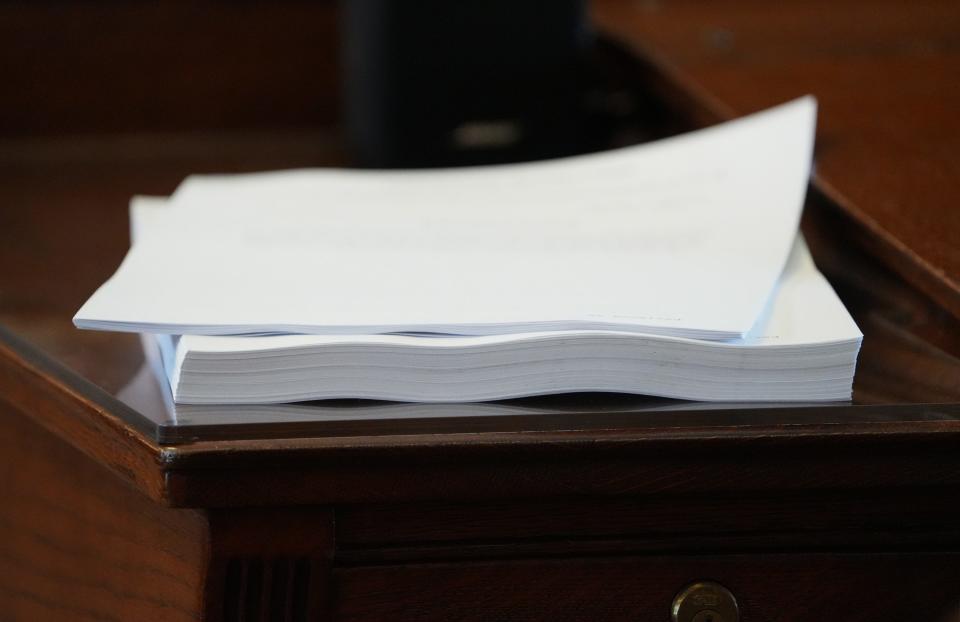 While the state budget of $321 billion, shown on a lawmaker's desk in the House, includes more than the original proposal of $302 billion from the House or $308 billion from the Senate, not everyone was pleased with the plan.