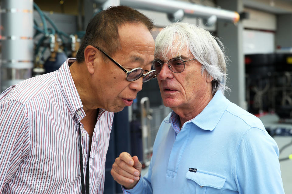 Ong Beng Seng of Singapore GP speaks with F1 supremo Bernie Ecclestone in the pit lane ahead of the Singapore Formula One Grand Prix at the Marina Bay Street Circuit on 19 September 2013 in Singapore. 