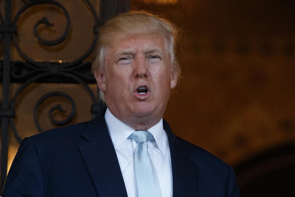 FILE - In this Dec. 28, 2016 file photo, President-elect Donald Trump speaks to reporters at Mar-a-Lago in Palm Beach, Fla. For almost eight years, the members of the Congressional Black Caucus existed in the shadow of the first black president, simultaneously praising President Barack Obama’s achievements while pushing him to do more for their constituents who overwhelmingly supported his history-making campaign and administration. (AP Photo/Evan Vucci, File)