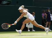 Britain Tennis - Wimbledon - All England Lawn Tennis & Croquet Club, Wimbledon, England - 5/7/16 Germany's Angelique Kerber in action against Romania's Simona Halep REUTERS/Stefan Wermuth