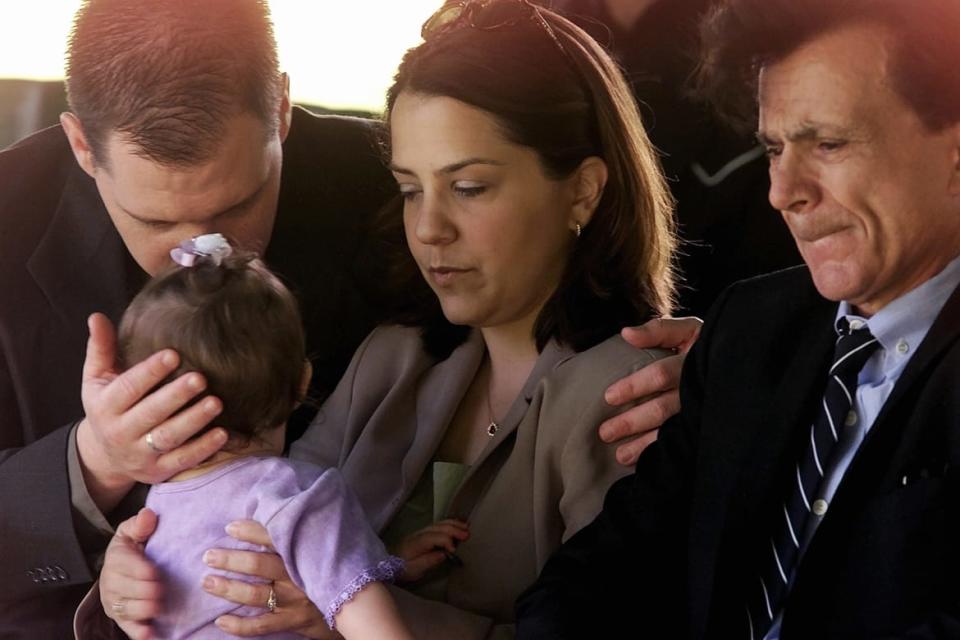 <div class="inline-image__caption"><p>Blake with his older daughter Delina and 11-month-old daughter, Rosie, at the grave site for his murdered wife Bonny Lee Bakley in 2001.</p></div> <div class="inline-image__credit">Reuters</div>