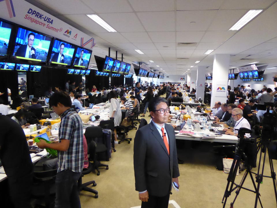 Martin Soong, co-anchor of CNBC’s Street Signs, prepares to file a ‘live’ cross at the International Media Centre at the F1 Pit Building in Singapore on 11 June 2018. PHOTO: Nicholas Yong/Yahoo News Singapore