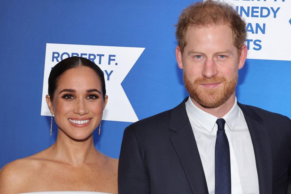 <p>Mike Coppola/Getty</p> Meghan Markle and Prince Harry at the Ripple of Hope Gala on Dec. 6, 2022