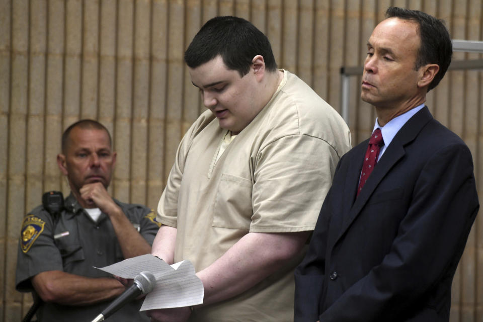 Peter Manfredonia reads a statement during his sentencing hearing in Milford Superior Court, in Milford, Conn., Wednesday, April 19, 2023. Manfredonia was sentenced to 55 years in prison Wednesday for the 2020 murder of his former high school classmate, Nicholas Eisele, in Derby and the kidnapping of Eisele's girlfriend Shannon Spies. Manfredonia is seen here with his defense attorney Michael Dolan. (Ned Gerard/Hearst Connecticut Media via AP, Pool)