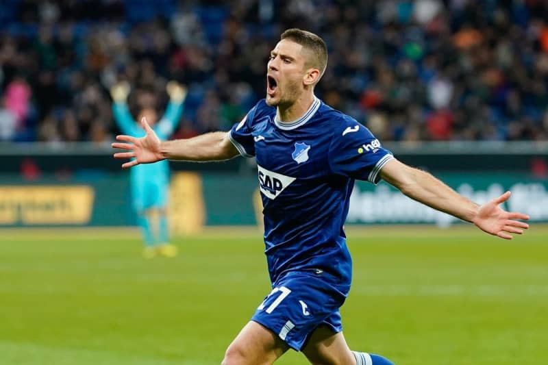 Hoffenheim's Andrej Kramaric celebrates scoring his side's first goal during the German Bundesliga soccer match between TSG 1899 Hoffenheim and RB Leipzig at PreZero Arena. Uwe Anspach/dpa