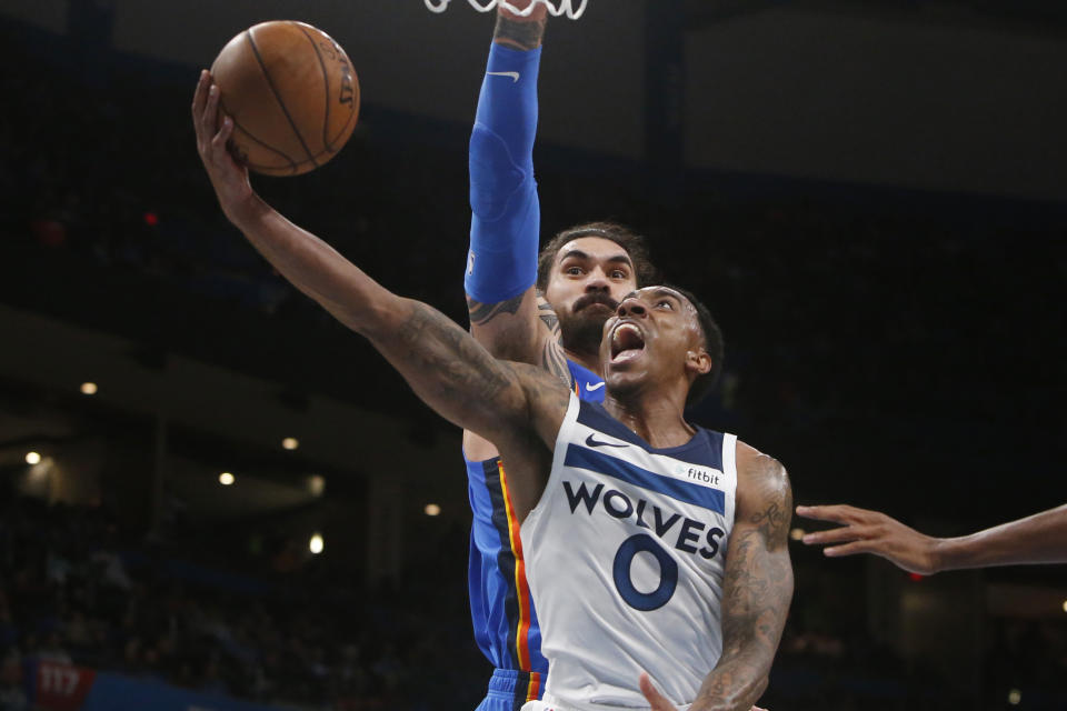 Minnesota Timberwolves guard Jeff Teague (0) goes up for a shot in front of Oklahoma City Thunder center Steven Adams during the first half of an NBA basketball game Friday, Dec. 6, 2019, in Oklahoma City. (AP Photo/Sue Ogrocki)