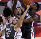 Washington State's Tony Miller (32) reaches for a rebound next to Southern California's Chevez Goodwin (1) during the first half of an NCAA college basketball game in Los Angeles on Saturday, Jan. 16, 2021. (Keith Birmingham/The Orange County Register via AP)