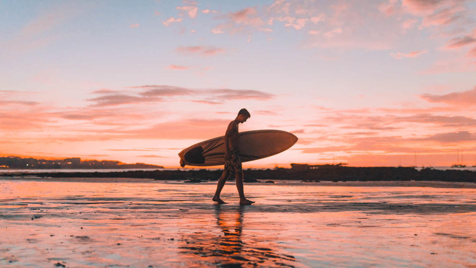 man beach surfboard costa rica zachary-shea-577599-unsplash