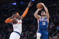 Philadelphia 76ers guard Raul Neto (19) shoots a three-point basket past New York Knicks guard Frank Ntilikina (11) in the first half of an NBA basketball game, Saturday, Jan. 18, 2020, at Madison Square Garden in New York. (AP Photo/Mary Altaffer)