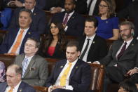 Rep.George Santos, R-N.Y., lower center, and other Republicans, gather in the House Chamber before President Joe Biden arrives to deliver his State of the Union speech to a joint session of Congress, at the Capitol in Washington, Tuesday, Feb. 7, 2023. (AP Photo/J. Scott Applewhite)