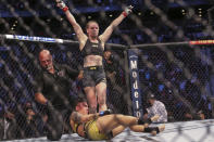 Valentina Shevchenko stands victorious over Jessica Andrade at the end of a UFC 261 mixed martial arts flyweight bout Saturday, April 24, 2021, in Jacksonville, Fla. (AP Photo/Gary McCullough)