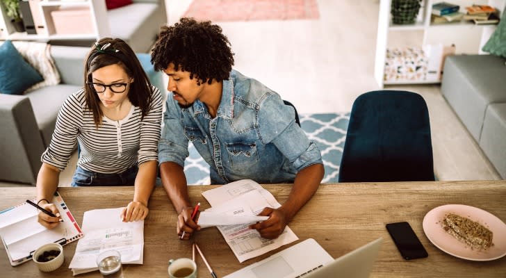 A couple looking at their stock that is being shorted and how it impacts their investment