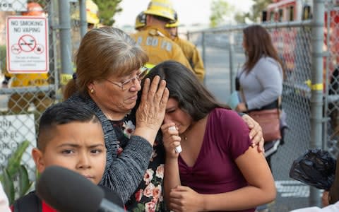 Seventeen children were hurt by the fuel - Credit: Damian Dovarganes/AP