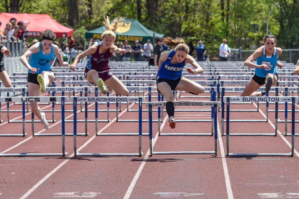 U32's Isabel Moustakas and North Country's Sabine Brueck finish with the exact same time of 15.622 in the 100 meter hurdles at the 51st annual Burlington High School Track and Field Invitational on Saturday.