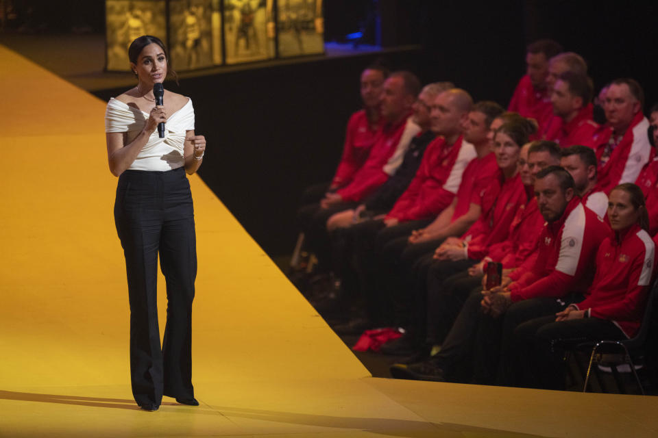 Meghan Markle, Duchess of Sussex, speaks during the opening ceremony of the Invictus Games venue in The Hague, Netherlands, Saturday, April 16, 2022. The week-long games for active servicemen and veterans who are ill, injured or wounded opens Saturday in this Dutch city that calls itself the global center of peace and justice. (AP Photo/Peter Dejong)