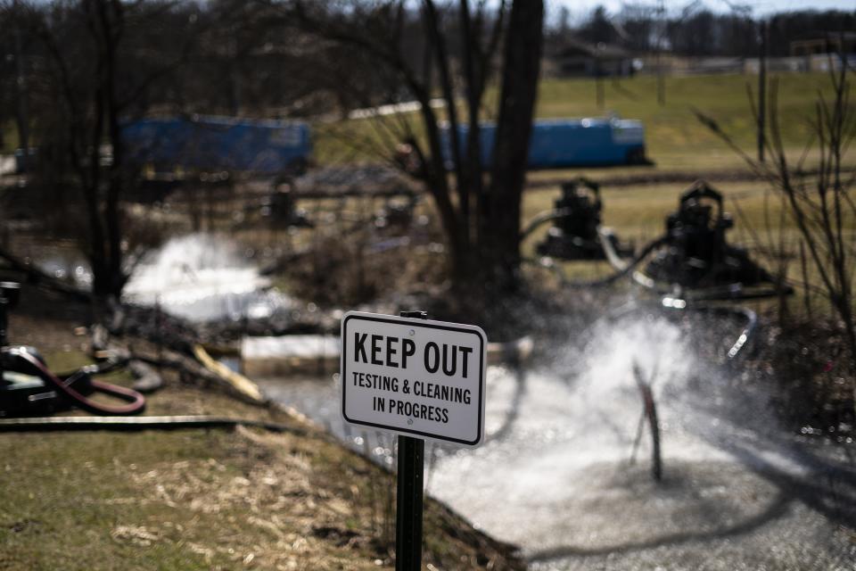 FILE - Cleanup of a creek is underway in the aftermath of a train derailment in East Palestine, Ohio, March 8, 2023. The Biden administration is initiating a formal evaluation of risks posed by vinyl chloride, the cancer-causing chemical that burned in a towering plume of toxic black smoke following a fiery train derailment earlier this year in eastern Ohio. (AP Photo/Matt Rourke, File)