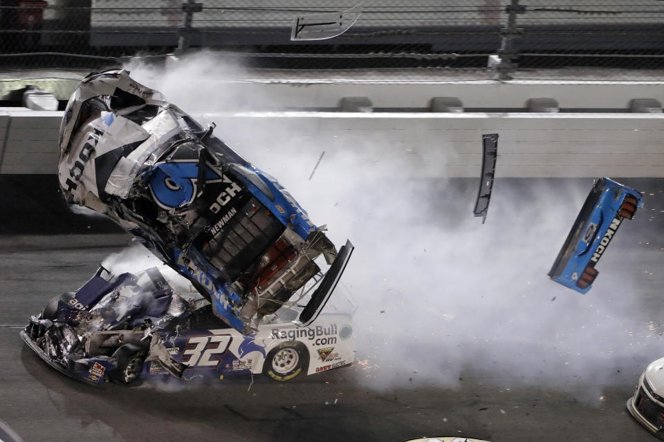 Ryan Newman (6) goes airborne after crashing into Corey LaJoie (32) during the NASCAR Daytona 500 auto race Monday, Feb. 17, 2020, at Daytona International Speedway in Daytona Beach, Fla. Sunday's running of the race was postponed by rain. (AP Photo/Chris O'Meara)