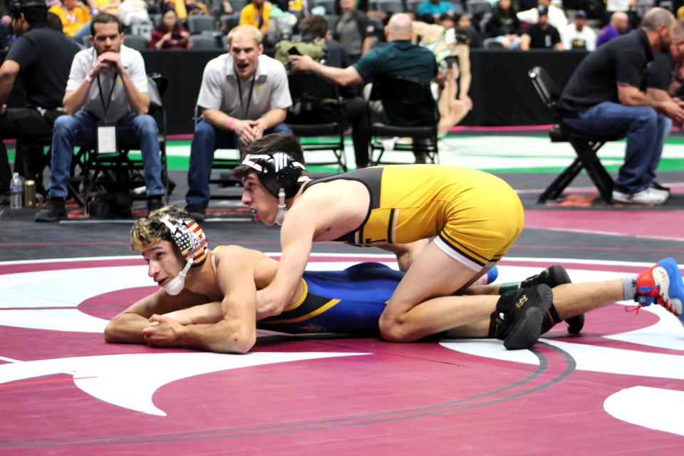 Pueblo East's Julian Espinoza maintains the wrist during top control of Isaiah Flores from Wheat Ridge during their Class 4A 120-pound matchup at CHSAA state wrestling on Thursday, Feb. 15, 2024.