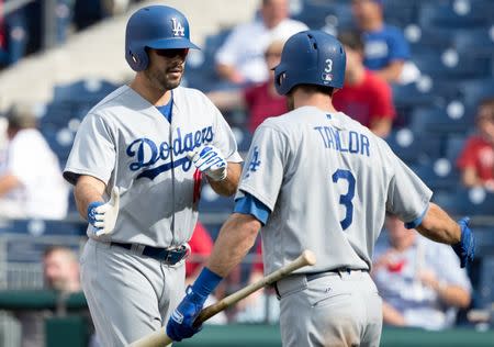 Sep 21, 2017; Philadelphia, PA, USA; Los Angeles Dodgers right fielder Andre Ethier (16) is congratulated by left fielder Chris Taylor (3) after hitting a home run during the seventh inning against the Philadelphia Phillies at Citizens Bank Park. Mandatory Credit: Bill Streicher-USA TODAY Sports