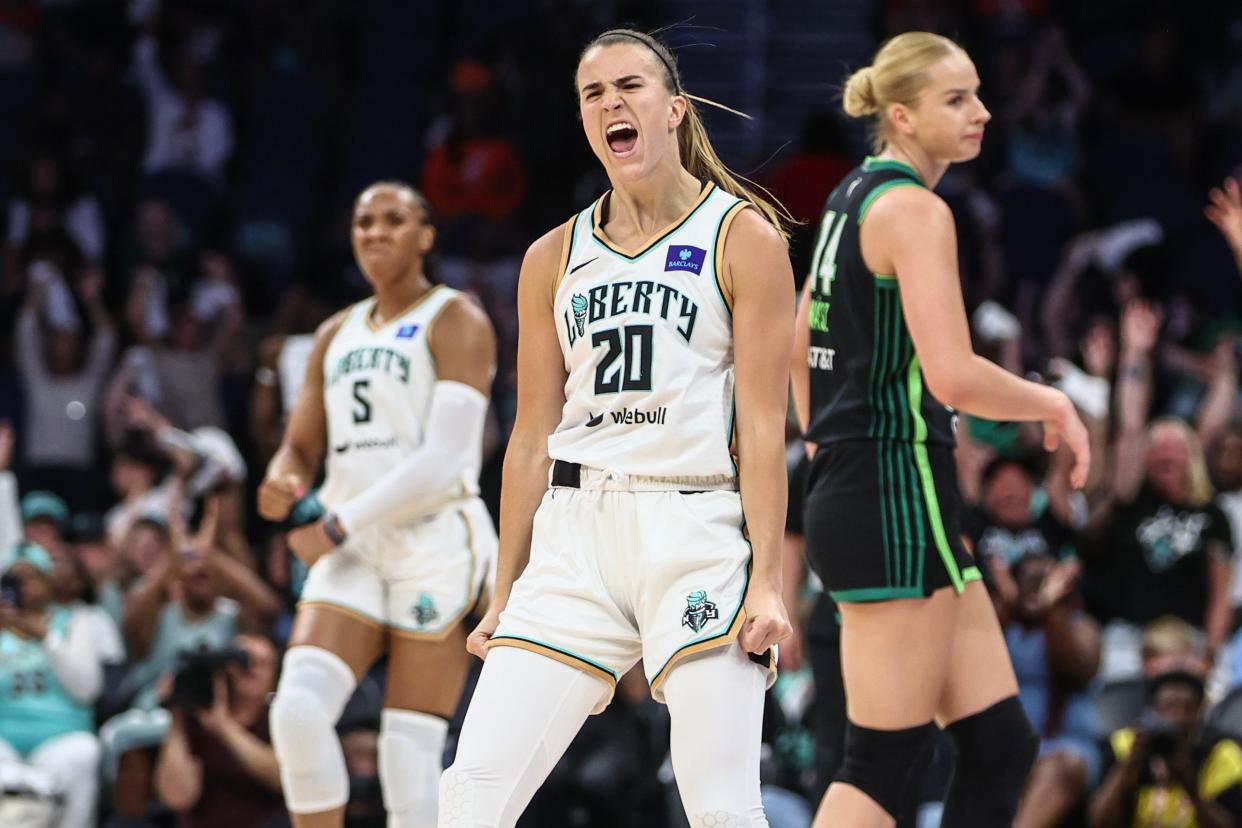 New York Liberty guard Sabrina Ionescu (20) celebrates after making a three point shot against the Minnesota Lynx in the second quarter of the Commissioner’s Cup Championship game at UBS Arena June 25, 2024, in Belmont Park, New York.