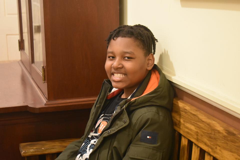 11 year-old hero La'Prentis Doughty smiles, weeks after saving his sister from his family's apartment fire, at the Charles H. Chipman Cultural Center in Salisbury, Md., on Wednesday, December 14, 2022.