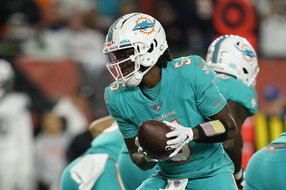 Miami Dolphins quarterback Teddy Bridgewater hands off during the first half of an NFL football game against the Cincinnati Bengals, Thursday, Sept. 29, 2022, in Cincinnati. (AP Photo/Joshua A. Bickel)