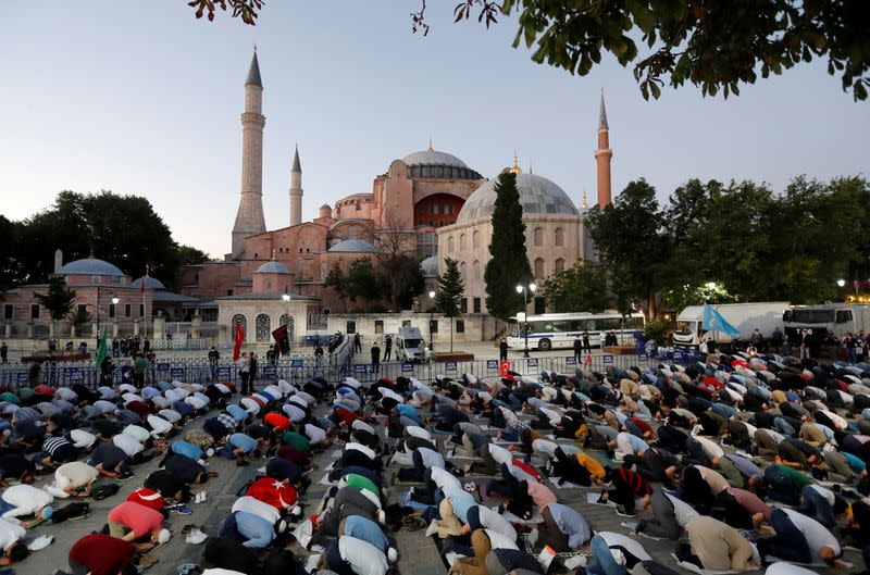 People gather in front of the Hagia Sophia or Ayasofya, after a court decision that paves the way for it to be converted from a museum back into a mosque, in Istanbul