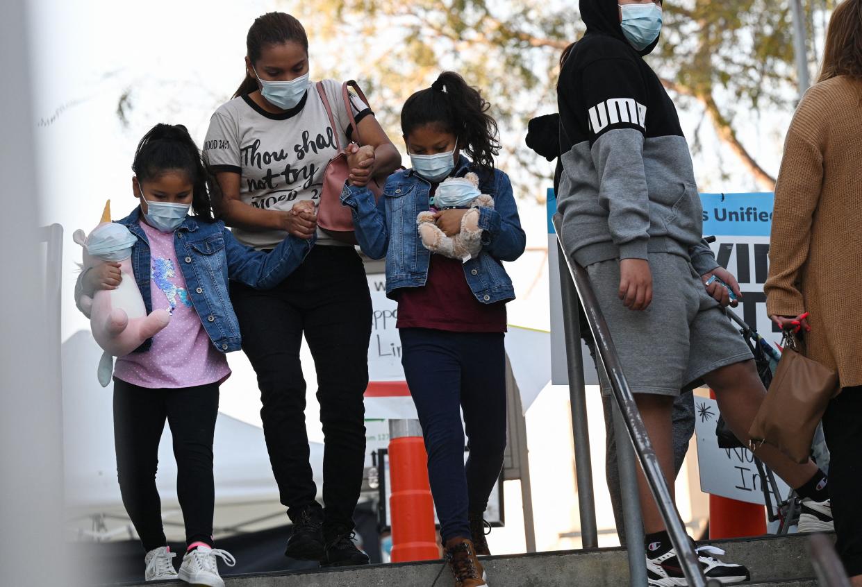 Children in the Los Angeles Unified School District, which saw more than 62,000 absences among students and school staff due to COVID-19 when they were scheduled to return to school on Tuesday. It's prompted an executive order from Gov. Gavin Newsom to address staffing issues. 