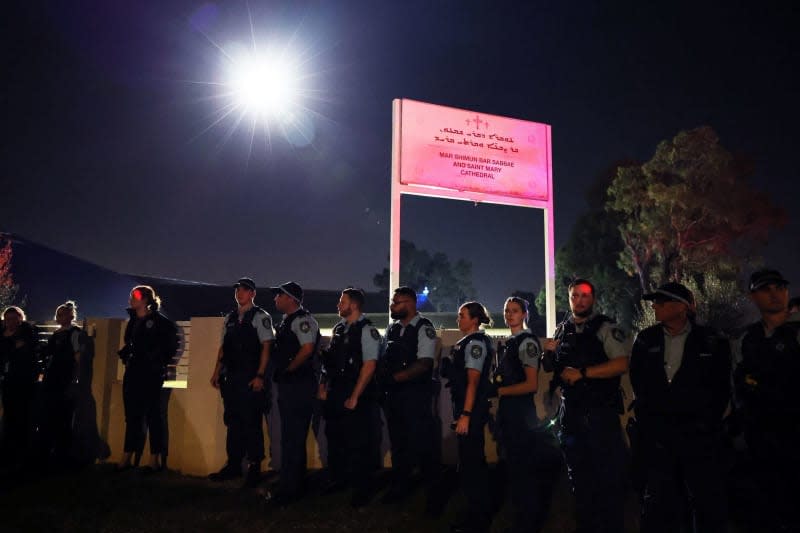 Police stand outside the Mar Shimun Bar Sabbae & Saint Mary Cathedral following a stabbing at Christ The Good Shepherd Church in the suburb of Wakeley in Sydney. A Christian bishop and three churchgoers have been stabbed by a man during a televised service in western Sydney. Paul Braven/AAP/dpa