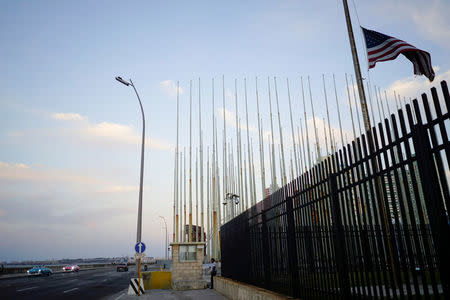 Vintage cars pass by the U.S. Embassy in Havana, Cuba, April 19, 2018. REUTERS/Alexandre Meneghini