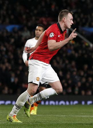 Manchester United's Phil Jones celebrates scoring during their Champions League soccer match against Shakhtar Donetsk at Old Trafford in Manchester, northern England December 10, 2013. REUTERS/Phil Noble