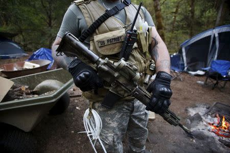 Members of the Oath Keepers provide security at the Sugar Pine Mine outside Grants Pass, Oregon April 22, 2015. REUTERS/Jim Urquhart