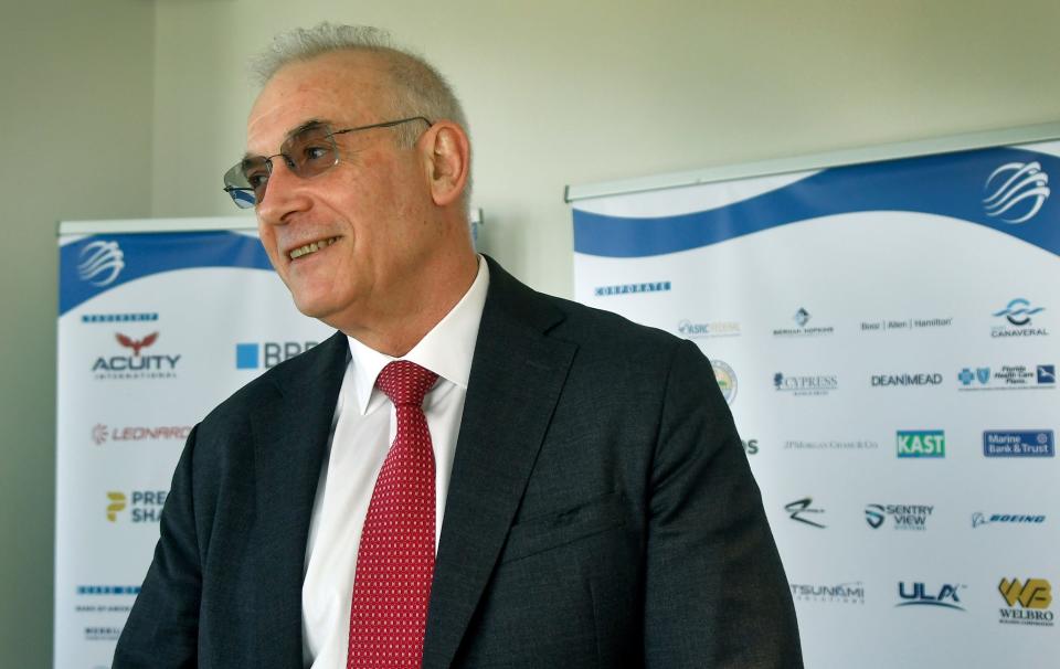 Dassault Falcon Jet CEO Thierry Betbeze talks to the media Wednesday at Hyatt Place Melbourne Airport.