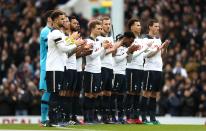 <p>Tottenham players have a minute’s applause for Graham Taylor </p>