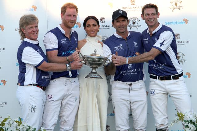 <p>Yaroslav Sabitov/PA Images via Getty </p> Prince Harry (second from left) and Meghan Markle (center) attend the Royal Salute Polo Challenge in Florida on April 12, 2024