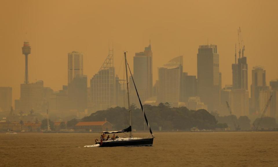 Smoke haze from bushfires shrouds Sydney Harbour.