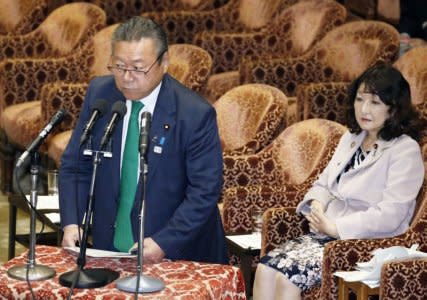 FILE PHOTO: Japan's Olympics and cybersecurity Minister Yoshitaka Sakurada, flanked by minister in charge of local economic revitalisation and female empowerment Satsuki Katayama attend at the lower house parliamentary session in Tokyo, Japan, in this photo taken by Kyodo November 14, 2018. Picture taken November 14, 2018.  Mandatory credit Kyodo/via REUTERS