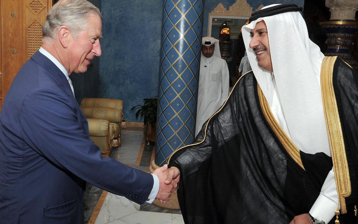The Prince of Wales with Sheikh Hamad Bin Jassim al Thani, at his residence outside Doha in 2013 - John Stillwell/PA Archive
