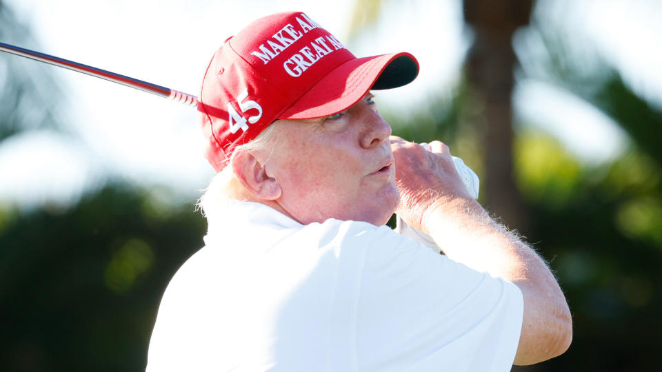   Donald Trump takes a shot during the pro-am before the 2022 LIV Golf Team Championship in Florida 