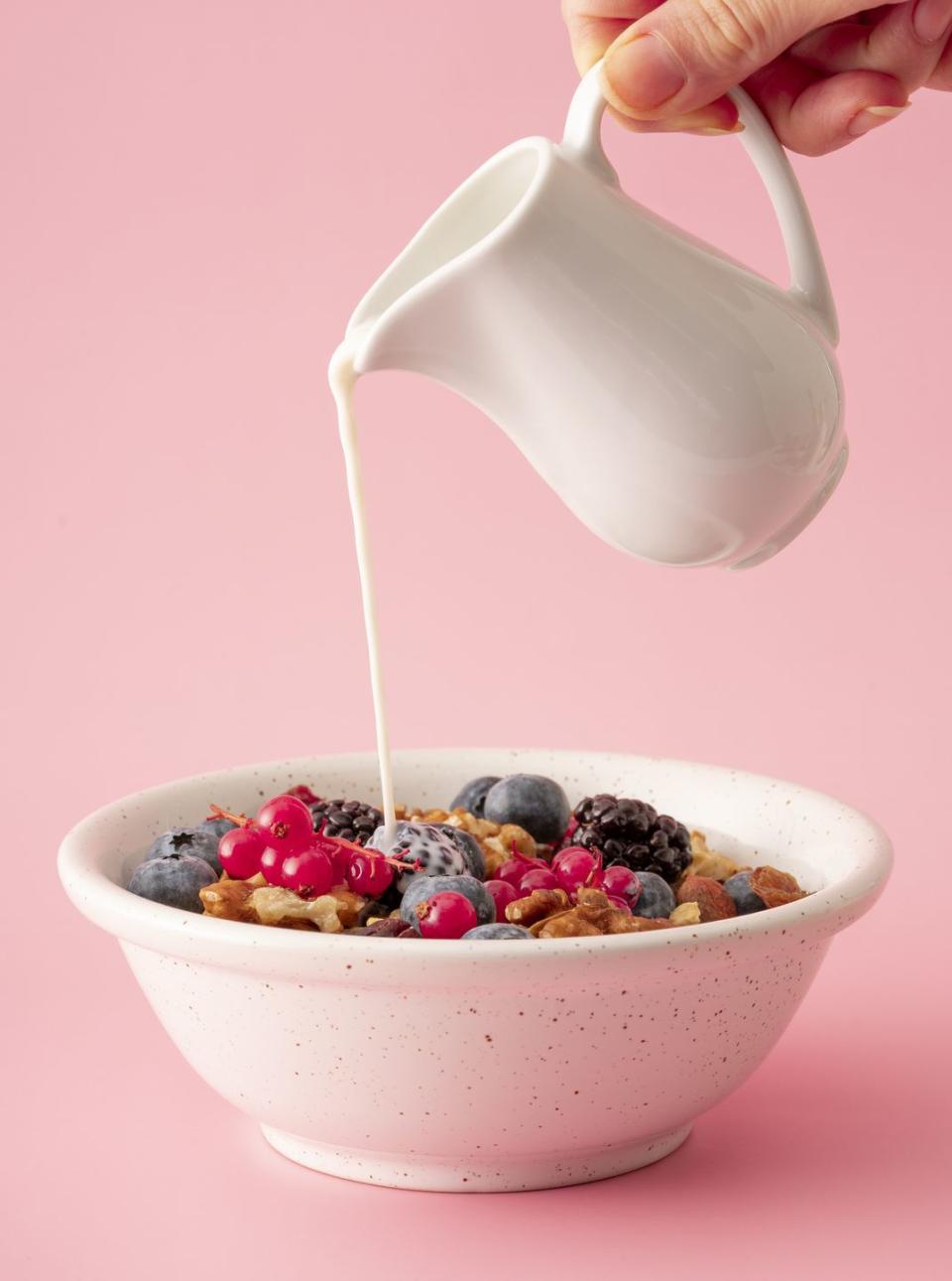 <p>Pour low-fat milk on your <a href="https://www.goodhousekeeping.com/food-products/g4111/best-healthy-cereal/" rel="nofollow noopener" target="_blank" data-ylk="slk:morning cereal;elm:context_link;itc:0;sec:content-canvas" class="link ">morning cereal</a> and you may have a belly-busting win. The minerals found in dairy products — calcium, potassium and magnesium — can help to counterbalance bloat-inducing sodium.</p>