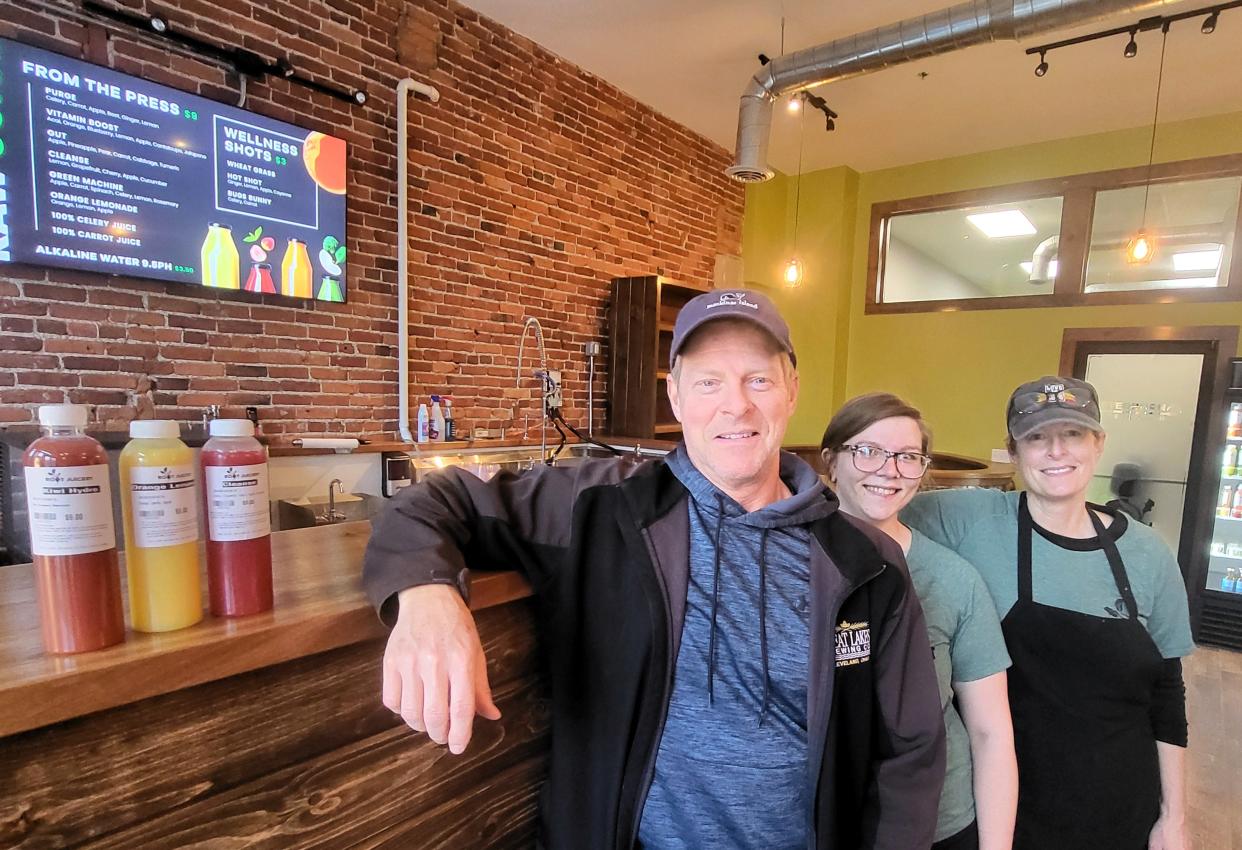 Root Juicery owner Jeff Payton, left, and Sierra Reckker and Barbara Payton show off a few juices carried at the new business on Tuesday, April 2, 2024, nearly a week after opening in downtown Port Huron. Jeff and Barbara Payton, his sister, said they were open to feedback from customers.
