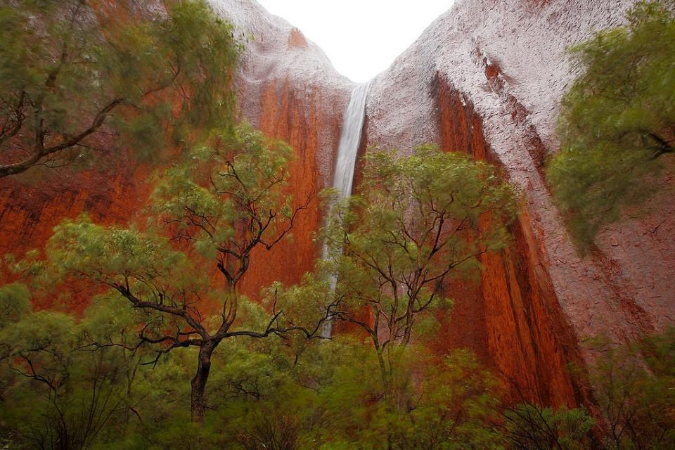 The torrential rains cause waterfalls to cascade down Uluru (Getty Images)