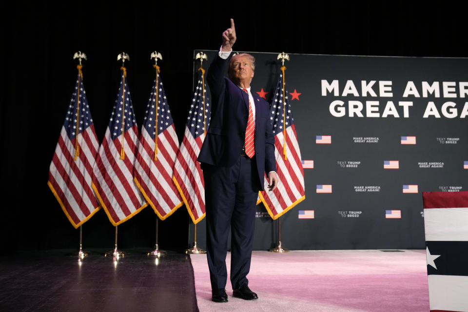 Former President Donald Trump walks off stage after a commit to caucus rally, Sunday, Oct. 29, 2023, in Sioux City, Iowa. (AP Photo/Charlie Neibergall)