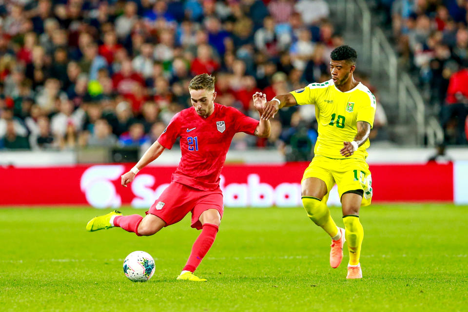 USA's forward Tyler Boyd (#21) vies for the ball with Guyana's forward Emery Welshman (#10) during the 2019 CONCACAF Gold Cup Group D match between USA and Guyana on June 18, 2019 at Allianz Field in Saint Paul, Minnesota. (Photo by Kerem Yucel / AFP)        (Photo credit should read KEREM YUCEL/AFP/Getty Images)