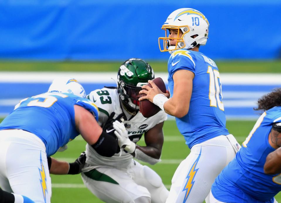 Los Angeles Chargers quarterback Justin Herbert (10) drops back to pass the ball against the New York Jets in the first half at SoFi Stadium.