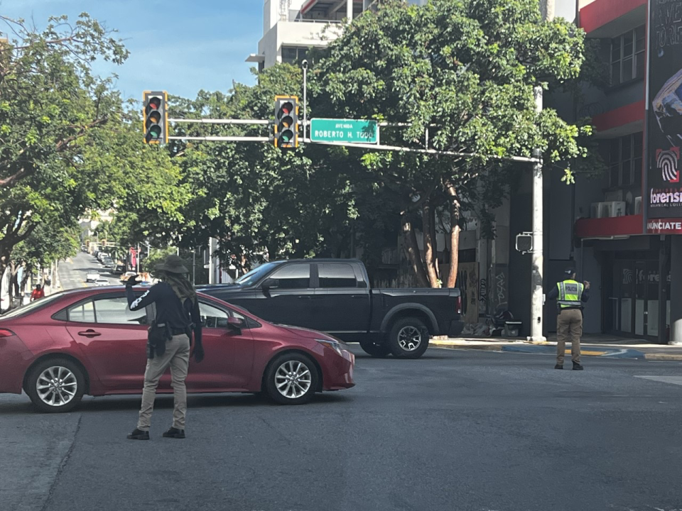 Police direct traffic in downtown Condado, Puerto Rico.