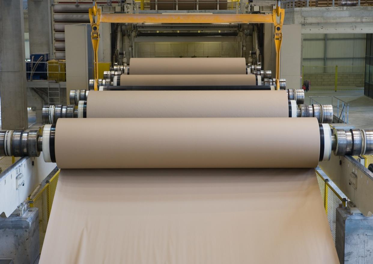 Roll of paper at a paper mill in a machine