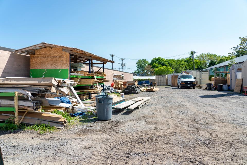 Located outside of the ReStore on Culver Road is a "boneyard" where volunteers store wood to build sheds and frames for homes. The organization is currently working to provide a shed for each habitat home.